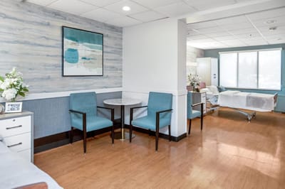 Bright interior of a resident room with seating area