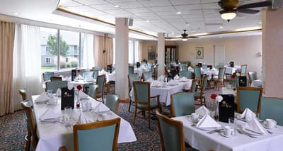 Dining area with tables set for a meal