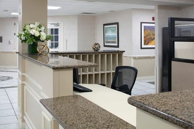 Reception area with seating and floral decor
