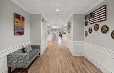 Hallway featuring art and seating area