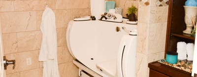 Accessible bathing area in a facility bathroom