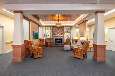 A cozy common area with seating and a fireplace