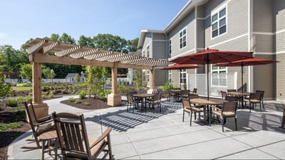 Outdoor patio area with seating and umbrellas