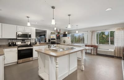 Bright kitchen with modern appliances and large windows