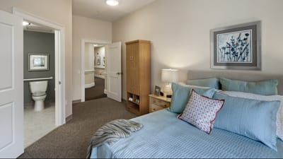 Cozy resident room with a bed and bathroom