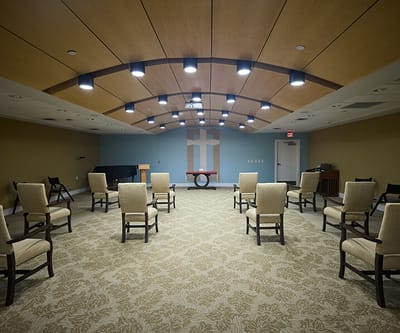 Bright activity room set up with chairs