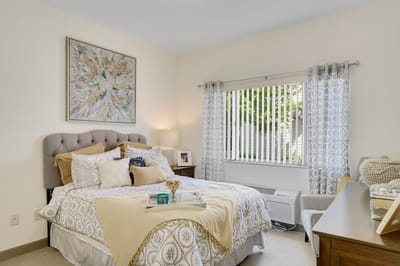 Cozy resident bedroom with a comfortable bed and decor