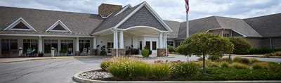 Front entrance of the Heritage Pointe facility with garden