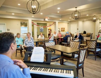 Residents enjoying a live music performance in a common area