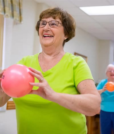 Residents participating in a recreational activity with balls