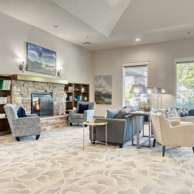 Bright common area with comfortable seating and fireplace