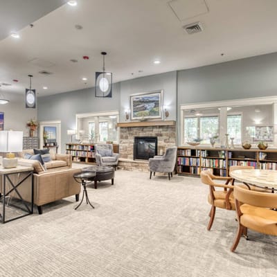 Bright common area with seating and bookshelves
