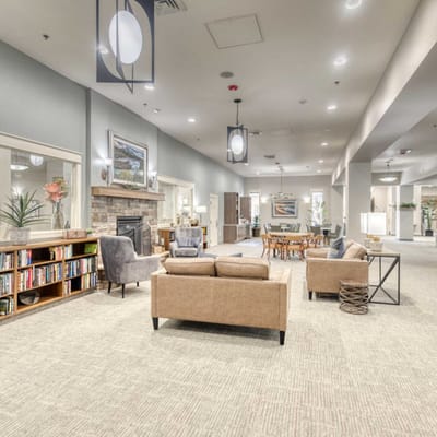 Bright common area with seating and bookshelves