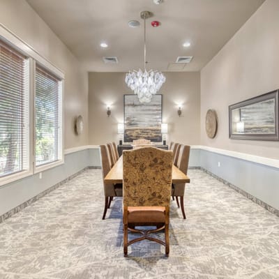 Elegant dining room with a large chandelier and decor