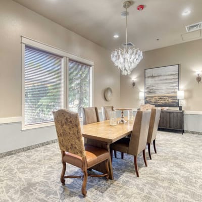Elegant dining area with a large table and chandelier