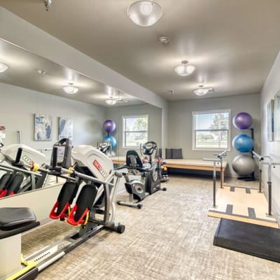 Well-equipped fitness room with exercise equipment