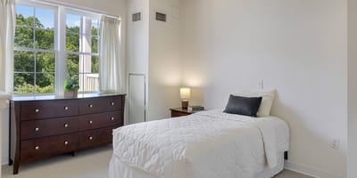 Cozy private resident room with light-colored furnishings