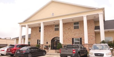 Exterior view of Apex Oaks at Cypress facility