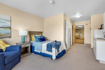 Cozy private room with bed and seating area