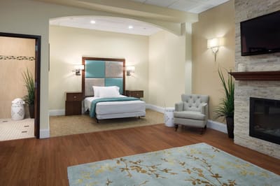 Well-furnished bedroom in a senior living facility
