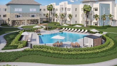 A serene outdoor pool area with lounge chairs and palm trees