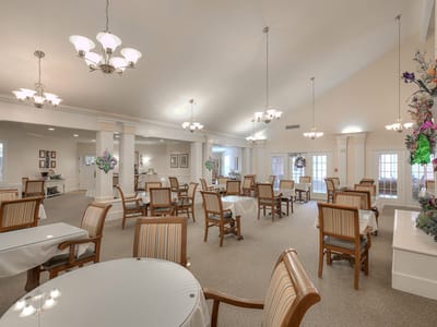Bright common area with tables and chairs
