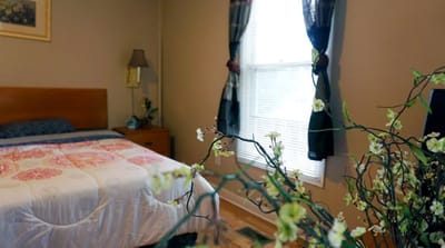 Cozy resident room with floral decor and window light