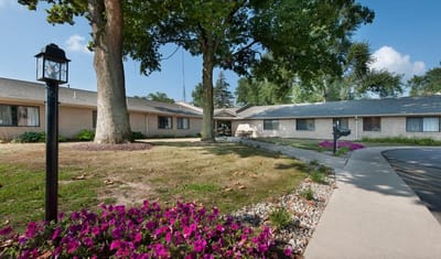Well-maintained outdoor space with flowers and seating area