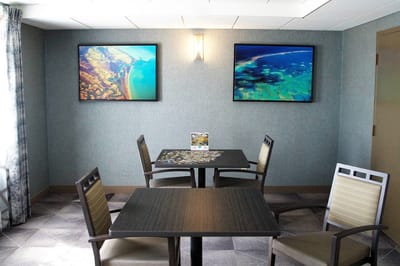 Bright activity room with puzzle and artwork