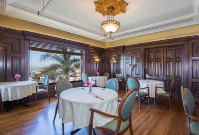 Elegant dining room with round tables and flowers