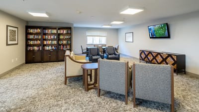 Interior common area with seating and bookshelves