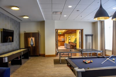 Activity room with billiards and pool tables