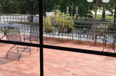 Outdoor patio with seating and potted plants