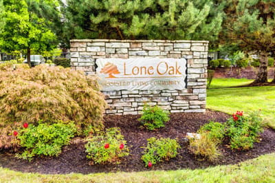 Lone Oak Assisted Living Community sign at the entrance