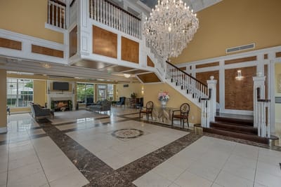 Bright interior lobby with elegant chandelier and seating area