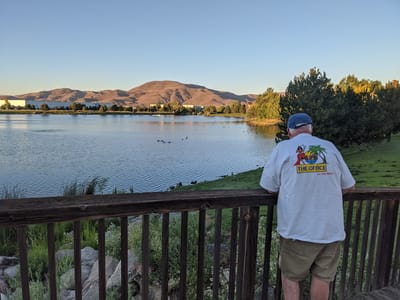 A resident enjoying the view by the lake