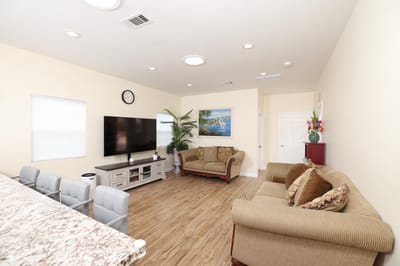 Common area with seating and television