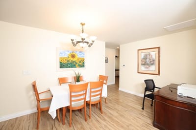 Bright dining area with table and chairs