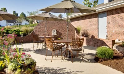 Outdoor seating area with umbrellas and flowers