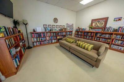 Cozy library room with bookshelves and seating