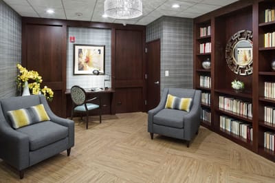 A cozy reading area with bookshelves and seating