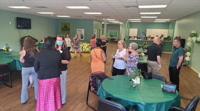Residents and staff interacting in a common area