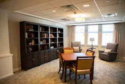 Common area with seating and bookshelves