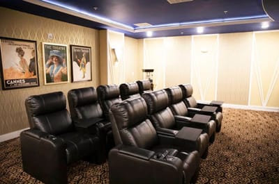 Cozy private theater room with leather seating