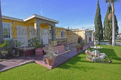 Exterior view of Villa Christa with landscaped entrance
