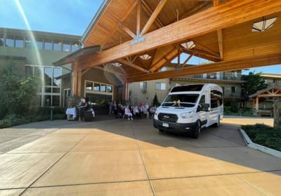 Residents and staff gathered under the facility's entrance