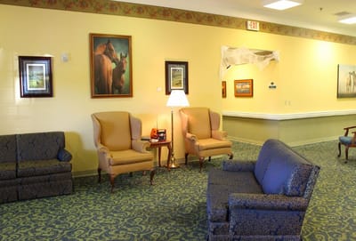 Interior lounge area with seating and artwork