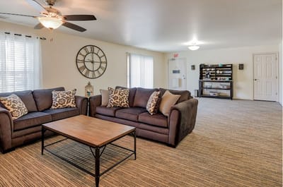 Cozy common area with sofas and a clock