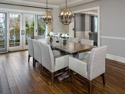 Modern dining room with a large table and elegant lighting