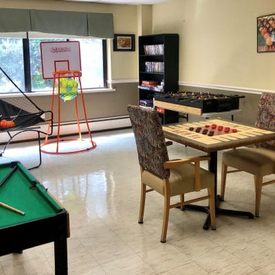 Activity room with pool table and seating
